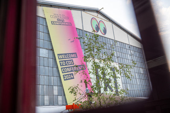 The building of Kampnagel with a poster of ContainerDays Conference 2024